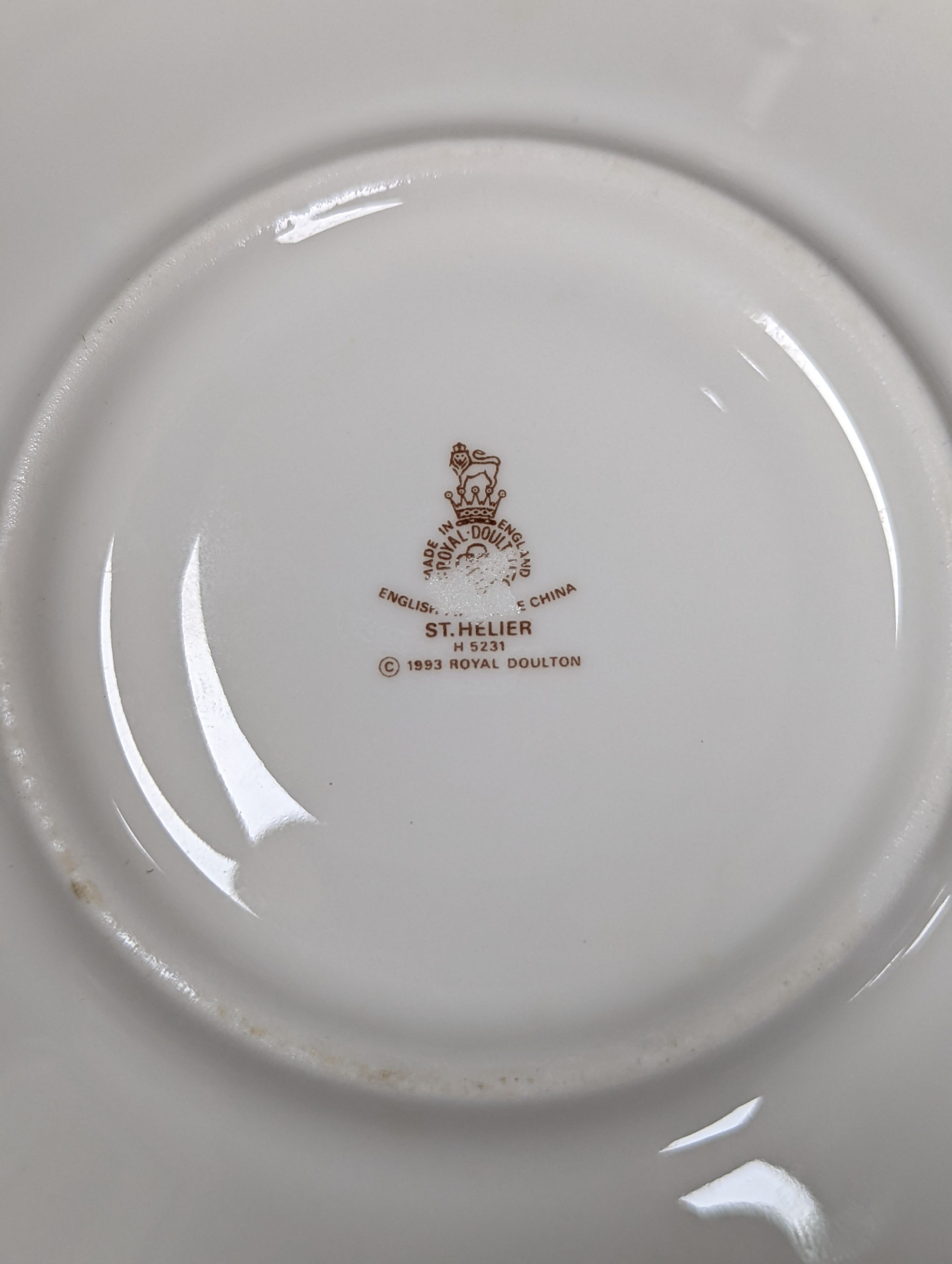 A Royal Doulton figure 'St Ellen' and a Royal Doulton St Helier teaset, figure 19 cms high.